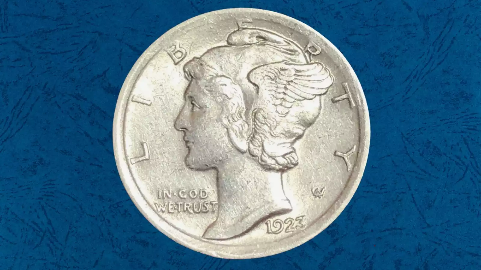 1923 Mercury dime broadstrike error showing expanded planchet, smooth edge, and spread design